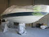 Bayliner 205 on hard stands preparation for hull repairs and respray